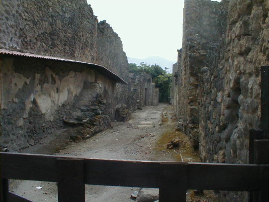 I.8 Pompeii. Vicolo dell’Efebo looking south.               Side wall of I.7.8 and I.7.9   