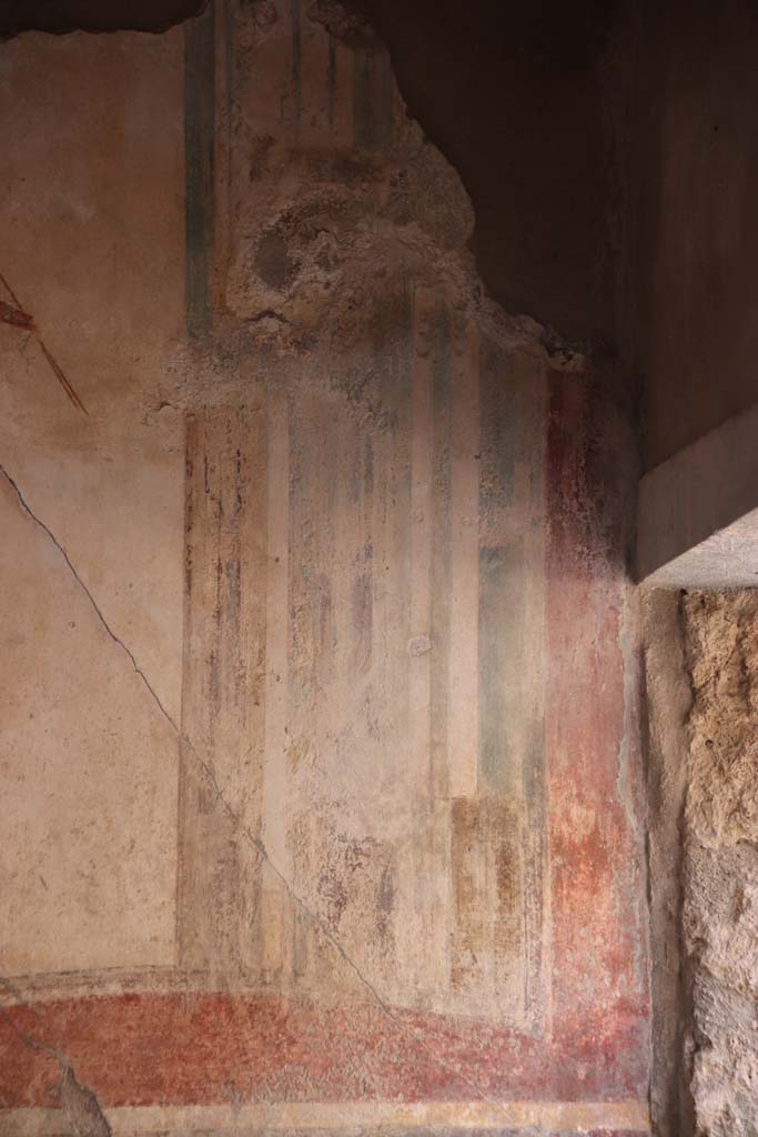 I.7.11 Pompeii. September 2021. 
Detail of figure from panel at east end of north wall of triclinium. Photo courtesy of Klaus Heese.

