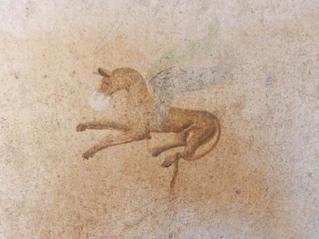 I.7.11 Pompeii. September 2021. Detail from centre of painted panel on west wall. Photo courtesy of Klaus Heese.