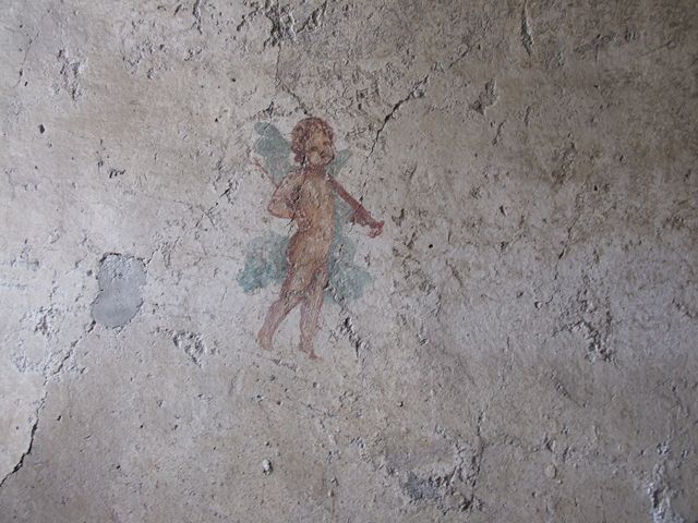 I.7.11 Pompeii. December 2006. Wall painting of cupid with sword from south wall of bedroom on west side of atrium.