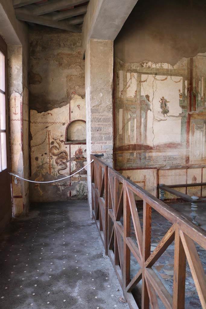 I.7.11 Pompeii. December 2018. 
Looking west with Lararium, at rear of west wall of triclinium. Photo courtesy of Aude Durand.


