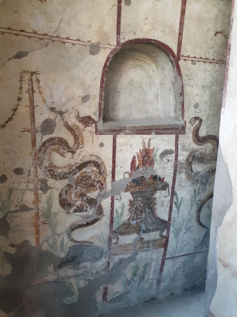 I.7.11 Pompeii. December 2018. Lararium against west wall. Photo courtesy of Aude Durand.