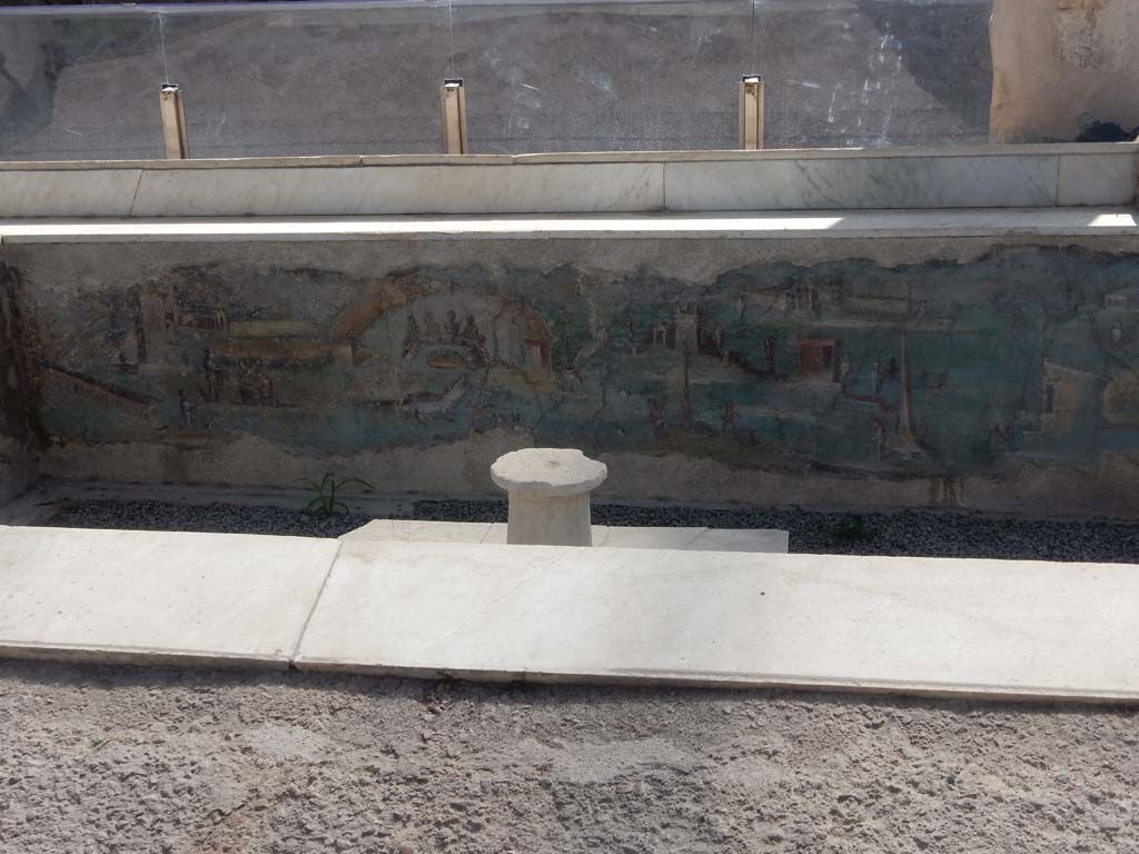 I.7.12 Pompeii. June 2019. Painted panel on inside of west side of summer triclinium. Photo courtesy of Buzz Ferebee.