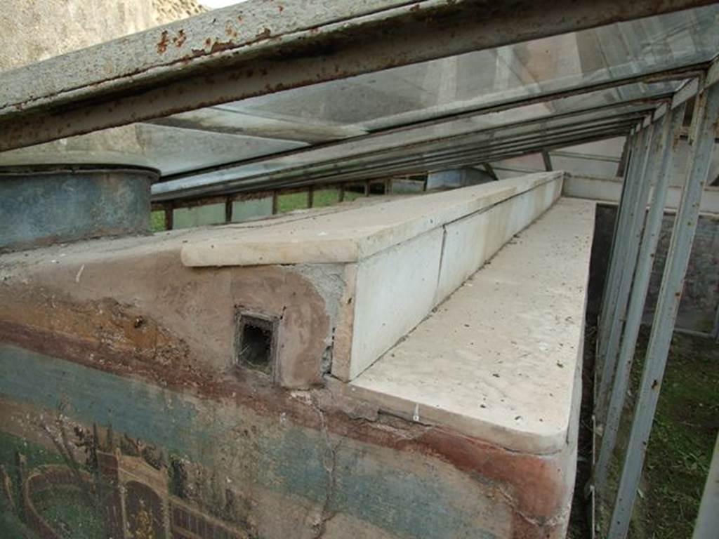 I.7.12 Pompeii. December 2006. Marble ledge on inside of summer triclinium.