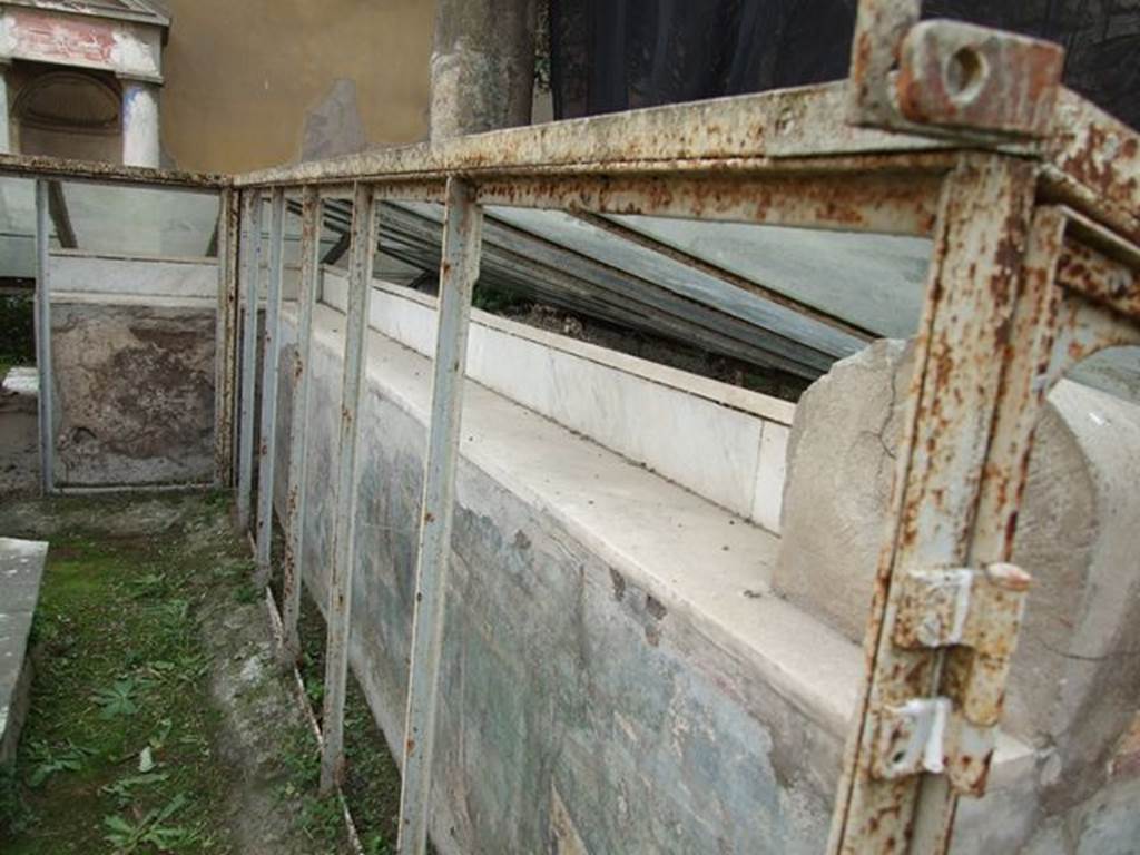 I.7.12 Pompeii. December 2006. Marble ledge on inside of summer triclinium.