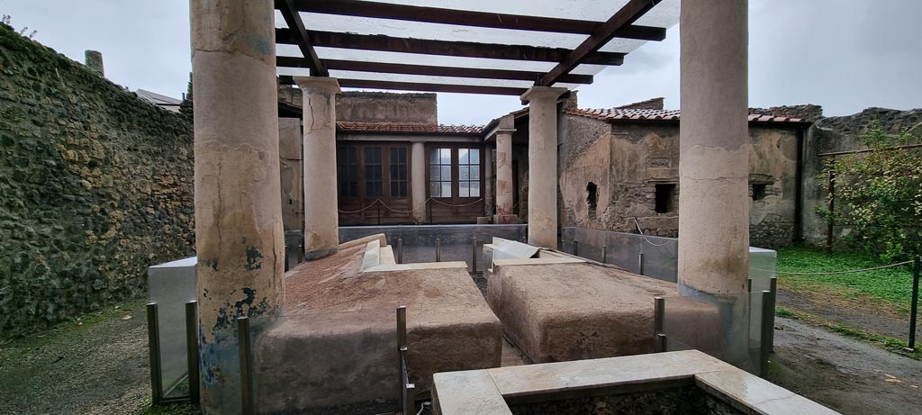 I.7.12 Pompeii. December 2023. Looking north across garden from rear of summer triclinium. Photo courtesy of Miriam Colomer.