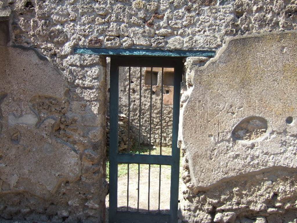 I.7.13 Pompeii. September 2005. Entrance doorway on Vicolo dell’Efebo, looking west.

