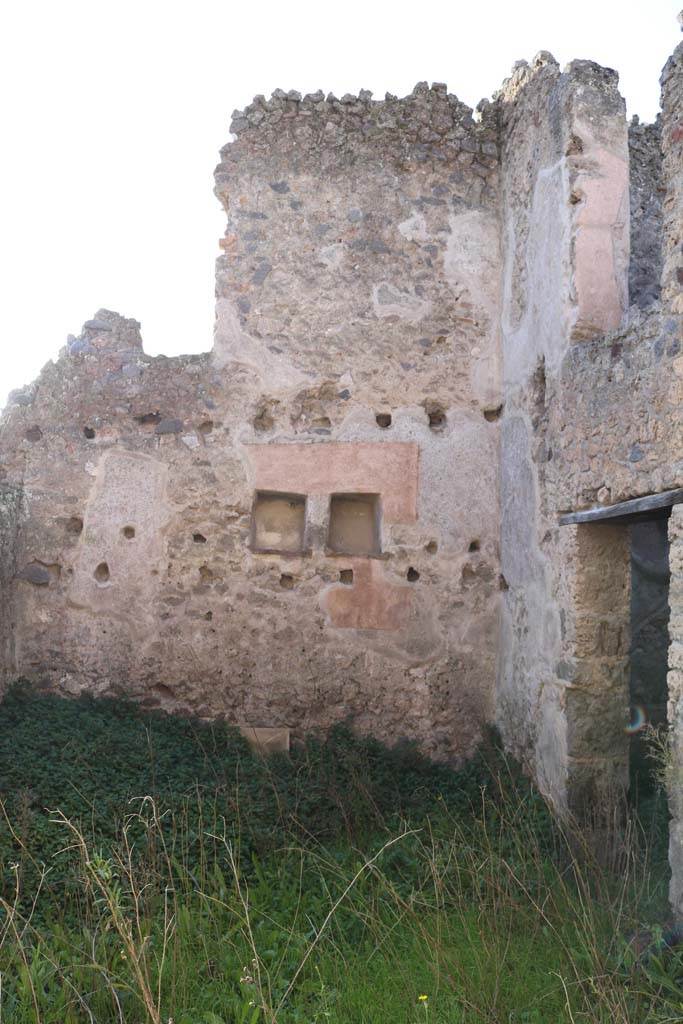 I.7.13 Pompeii. December 2018. 
Looking towards west wall of atrium of I.7.14, with two niches. Photo courtesy of Aude Durand.
