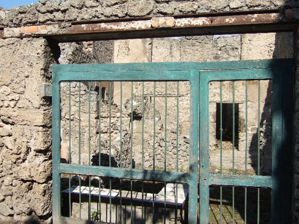 I.7.14 Pompeii. September 2005. Entrance doorway to bar, looking north. According to Della Corte, the keeper of the bar was a certain Masculus, as proved by three electoral recommendations. Two were painted on the wall to the left of the doorway, and one on the right of it 
Masculus rog(at)    [CIL IV 7238]
[Masc]u[l]us cupit    [CIL IV 7239]
Masculus cum codatis ubique (rogat)    [CIL IV 7240]
See Della Corte, M., 1965.  Case ed Abitanti di Pompei. Napoli: Fausto Fiorentino. (p.319)
According to Epigraphik-Datenbank Clauss/Slaby (See www.manfredclauss.de), these read 
Q(uintum) Postumium Proculum 
aed(ilem) d(ignum) r(ei) p(ublicae) Masculus rog(at)       [CIL IV 7238]
Ceium aed(ilem) 
[Masc]u[l]us cupit       [CIL IV 7239]
Cn(aeum) Helvium 
Sabinum aed(ilem) d(ignum) r(ei) p(ublicae) o(ro) v(os) f(aciatis) Masculus cum codatis ubiq(ue)       [CIL IV 7240]
