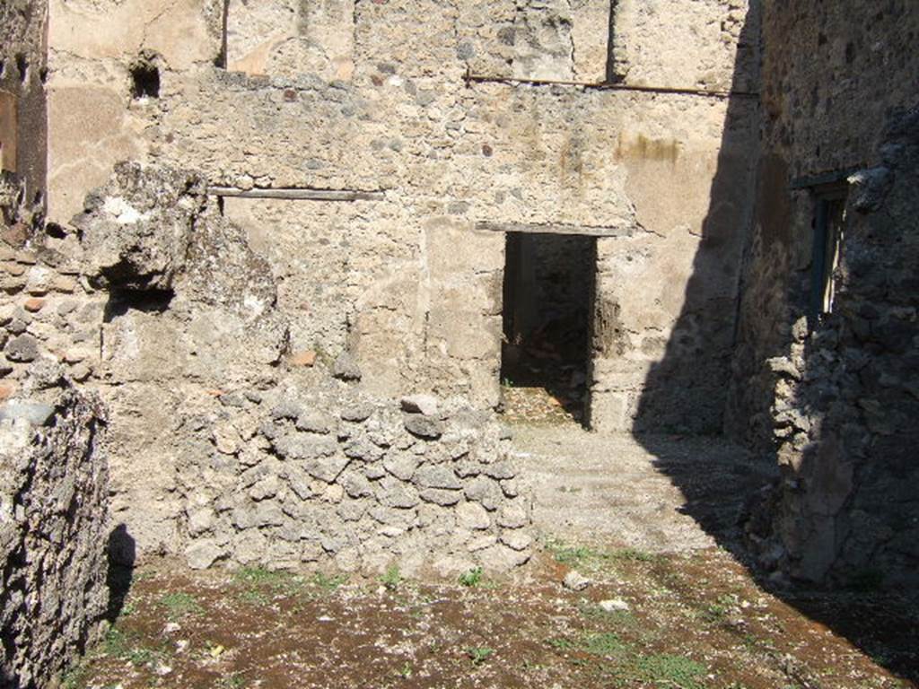 I.7.14 Pompeii. September 2005. Looking north from bar-room, to room with I.7.13 in east wall, and doorway to rear room.