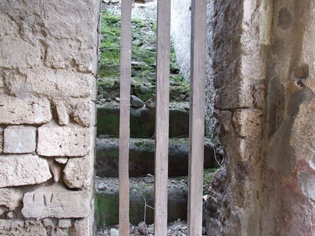 I.7.19 Pompeii. December 2006. Looking south up steps to upper floor, in the south-east corner of the peristyle area.