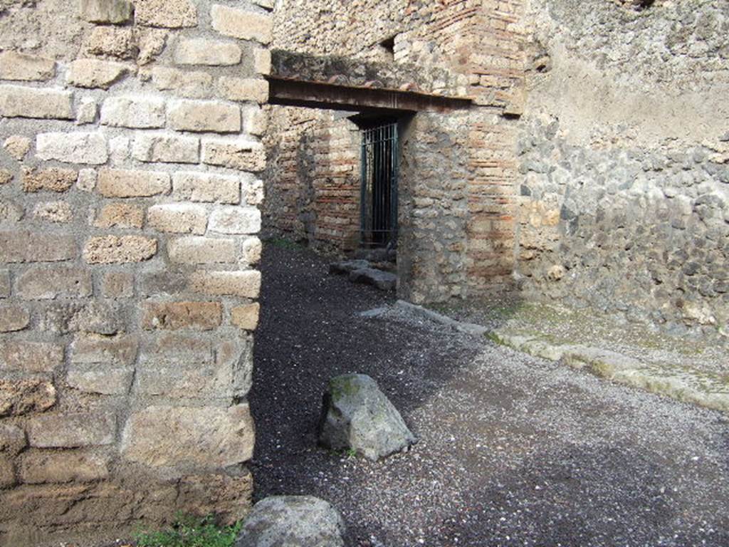 I.7.20 from I.10.1 Pompeii. December 2005. Looking north-east across road junction.