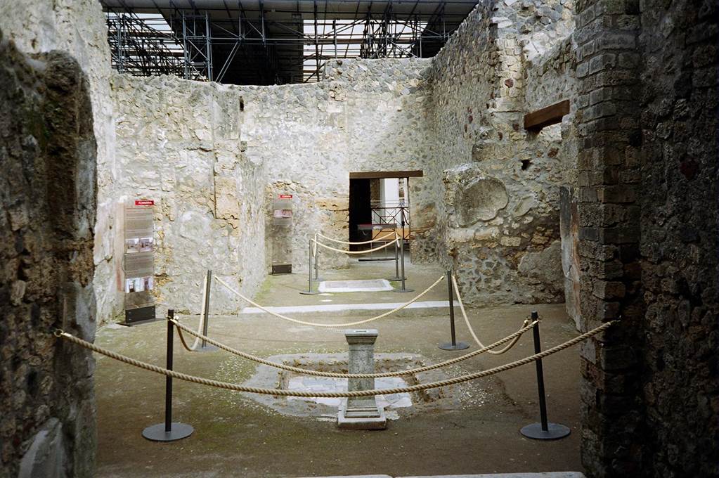 I.8.9 Pompeii.  March 2010.  Room 1, atrium with impluvium. Looking north to room 2, oecus. Photo courtesy of Rick Bauer.