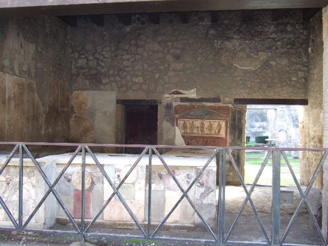 I.8.8 Pompeii. May 2015. Information notice-board, note the “private part of the house” can be seen at I.8.9 Photo courtesy of Buzz Ferebee.
