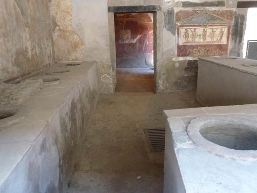 I.8.8 Pompeii. December 2018. 
Rear wall of bar-room, doorway to rear room, on left, doorway to oecus, atrium and dwelling, on right. Photo courtesy of Aude Durand.
