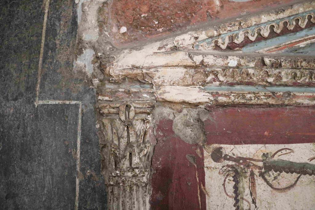 I.8.8 Pompeii. December 2018. Detail of central area of pediment on south wall above lararium. Photo courtesy of Aude Durand.