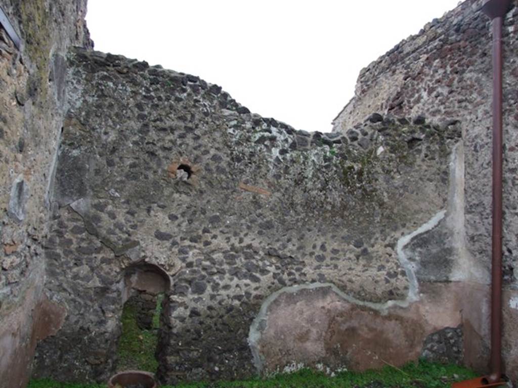 I.8.14 Pompeii. December 2007.  Room 6.  West wall with recess with terracotta pot at base and view through to I.8.15/16.
