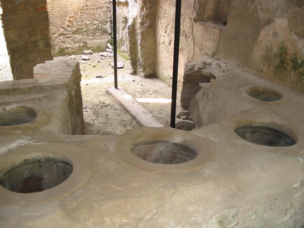 I.8.15 Pompeii. October 2017. Looking towards podium in bar room, and doorways to two rear rooms on its north side.
Foto Taylor Lauritsen, ERC Grant 681269 DÉCOR.
