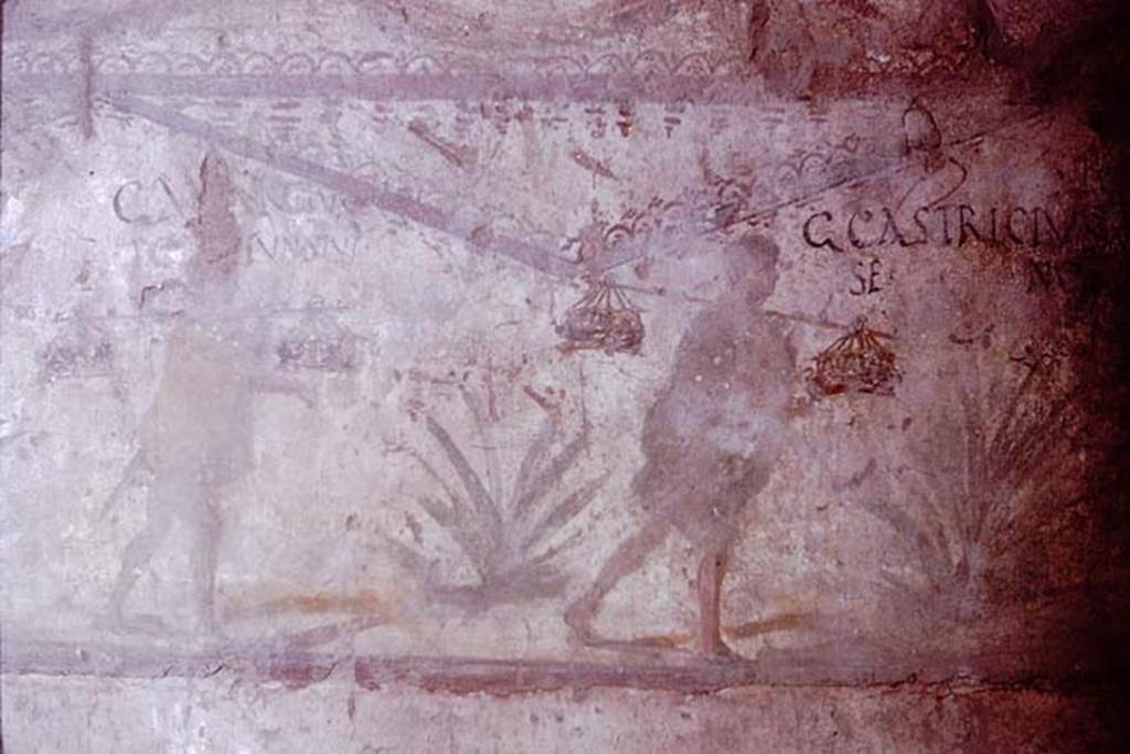 I.8.15Pompeii. December 2018. Remaining painted decoration on upper east wall, above niche. Photo courtesy of Aude Durand.