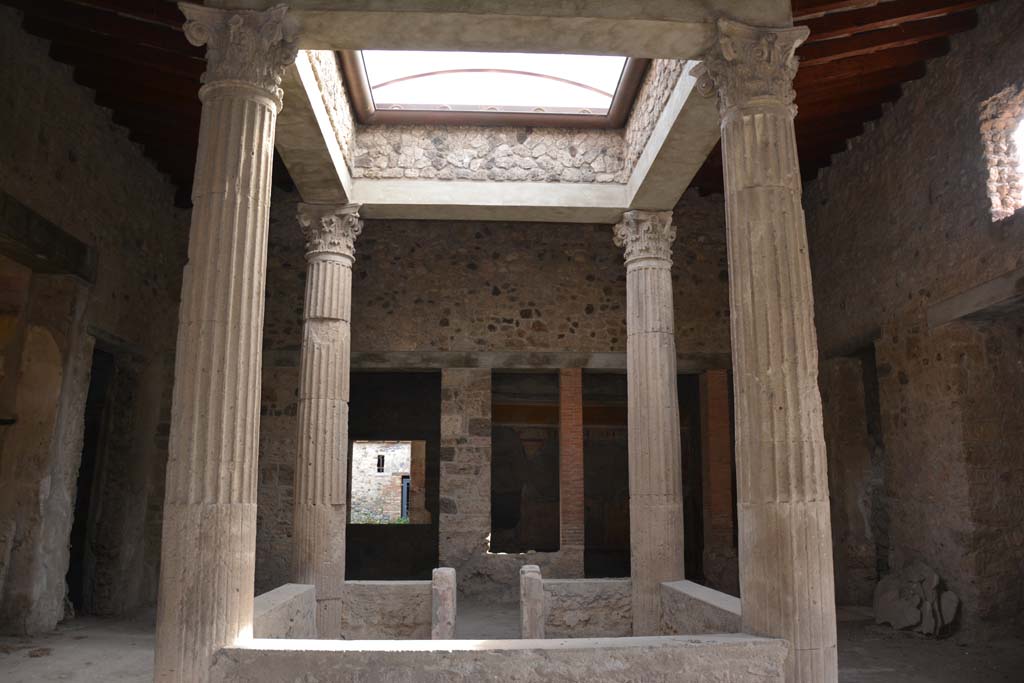 I.8.17 Pompeii. March 2019. Atrium 3, looking east across impluvium towards table-legs.  
Foto Annette Haug, ERC Grant 681269 DCOR.

