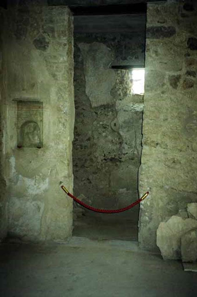 I.8.17 Pompeii. June 2010. Doorway to room 8 and niche, in south-east corner of atrium. Photo courtesy of Rick Bauer.