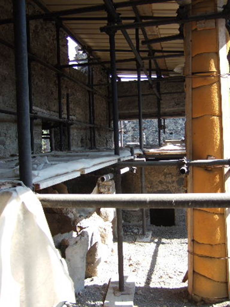 I.8.19 Pompeii. September 2005. Looking east from entrance, north side of room on the left.