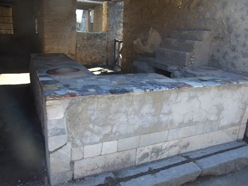 I.9.4 Pompeii.  March 2009.  Marble counter.