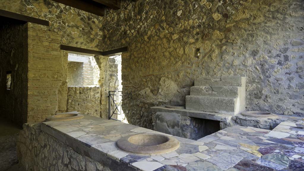 I.9.4 Pompeii. August 2021. Looking south-west across top of podium/counter. Photo courtesy of Robert Hanson.