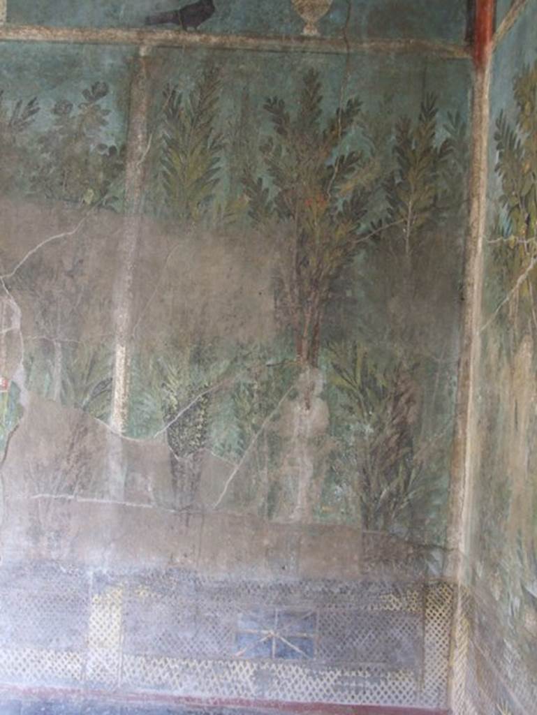 I.9.5 Pompeii. October 2022. 
Room 5, detail of painted figure at east end of north wall. Photo courtesy of Klaus Heese.

