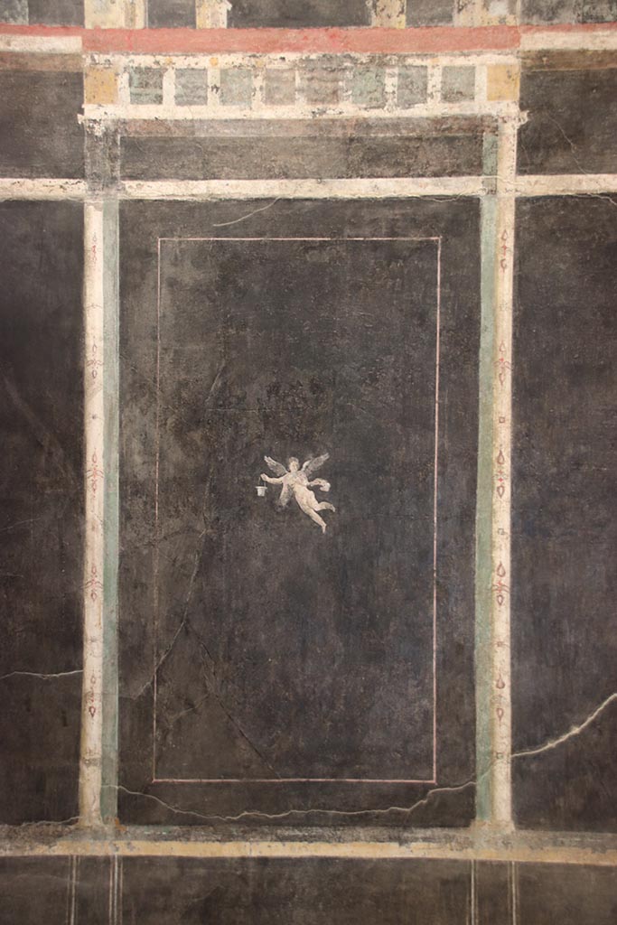 I.9.5 Pompeii. October 2024. Room 10, panel on east wall with painted flying figure. Photo courtesy of Klaus Heese