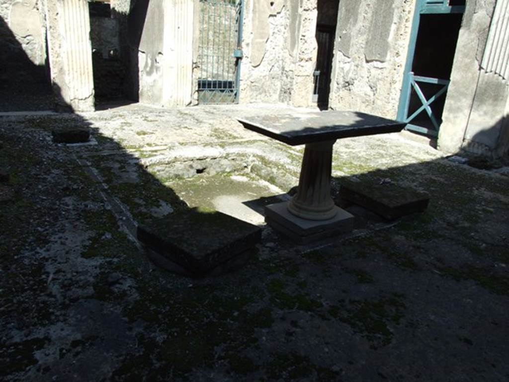 I.9.5 Pompeii. March 2009. Room 3, travertine table in atrium.