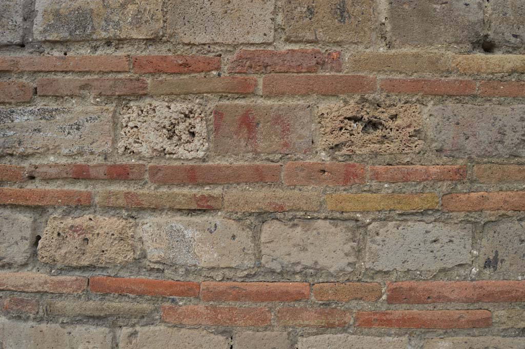 I.9.11 Pompeii. October 2017. Detail of (painted inscription on?) masonry on east (right) pilaster from entrance doorway.
Foto Taylor Lauritsen, ERC Grant 681269 DÉCOR.


