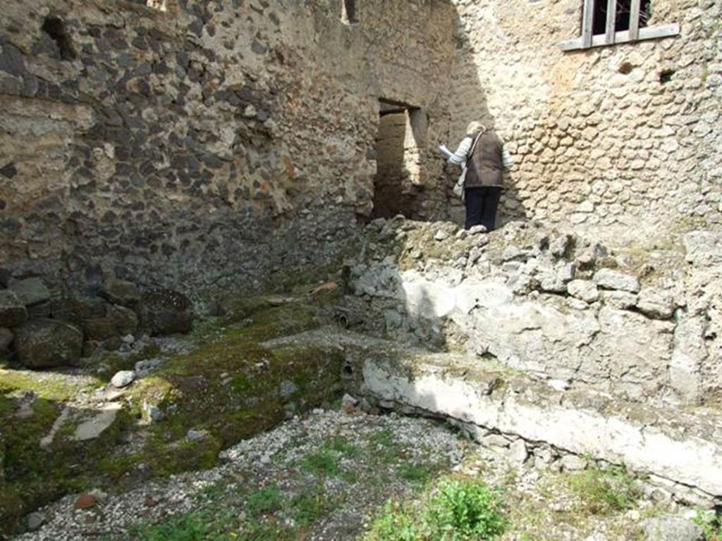 I.9.11 Pompeii.  March 2009.  Door in north west corner of yard, leading back into Room 7 of I.9.12.