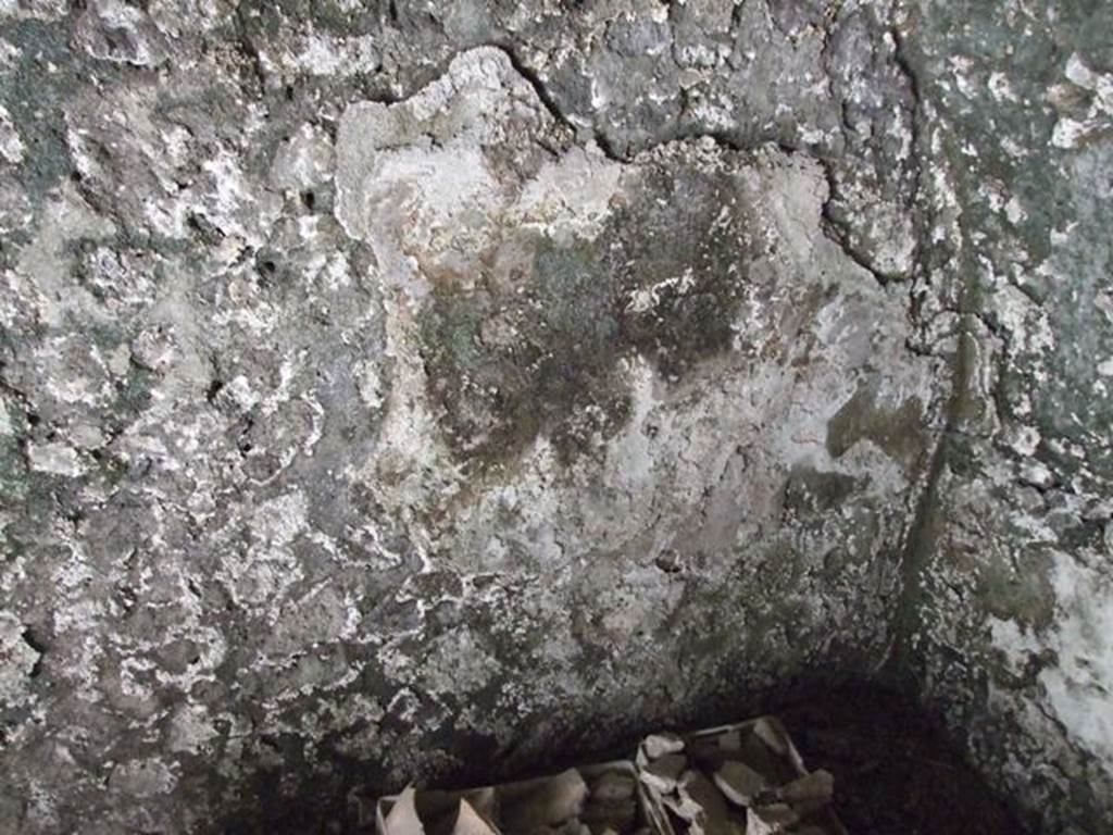 I.10.4 Pompeii.  March 2009.  First Lower storeroom A. West wall, with detail of remaining plaster.