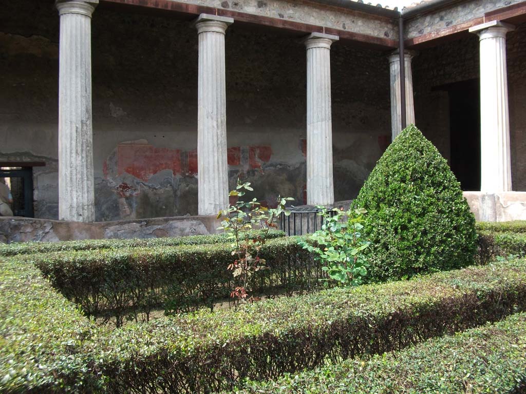 I.10.4 Pompeii. May 2010. Looking north-west across peristyle garden on the route of the Sarno canal below.