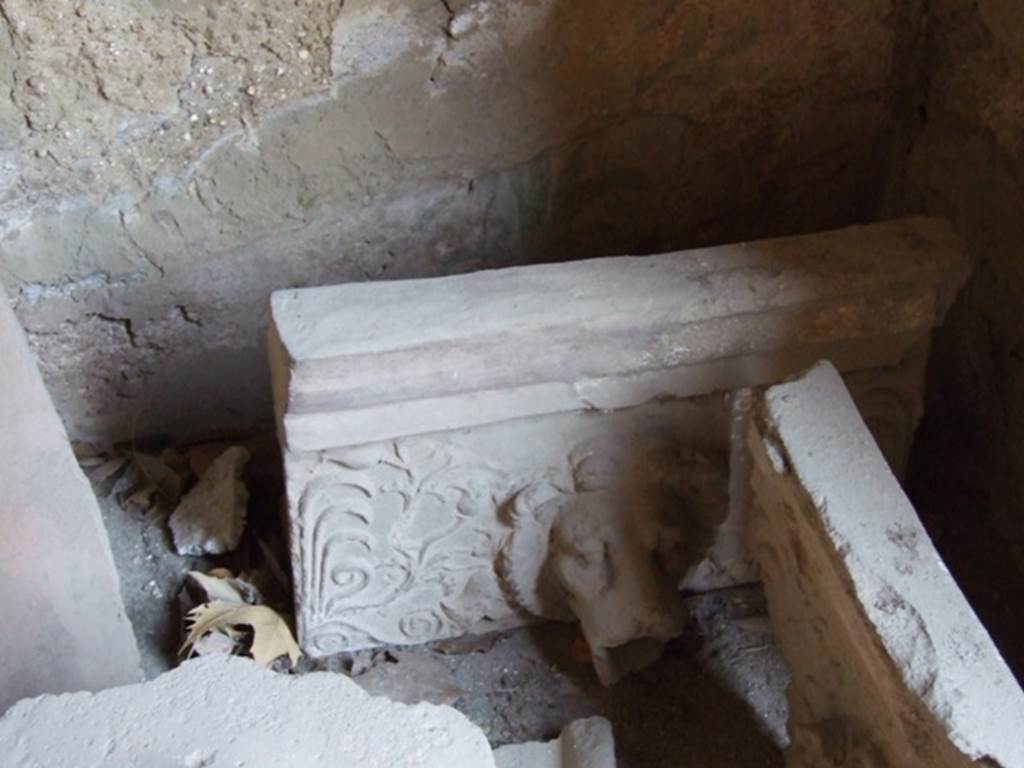 I.10.7 Pompeii. March 2009.  Room 3.   Cubiculum.  Remains of a Lion.  Grondaia or antefisse fittili  (rainwater spouts for gutters).