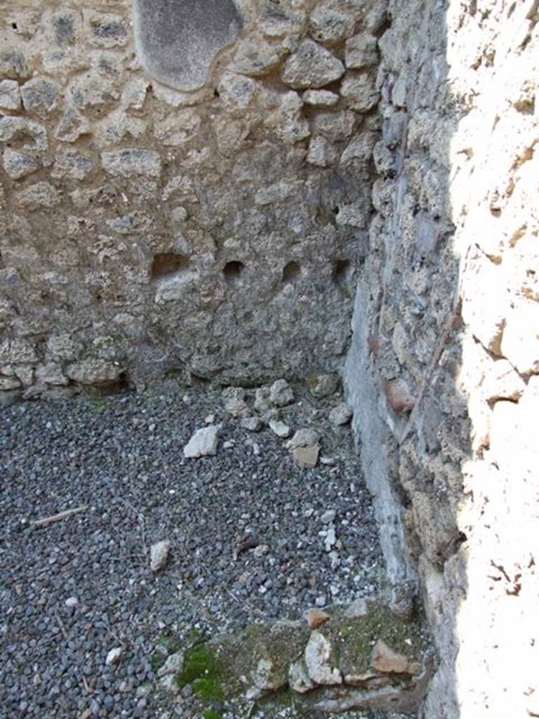 I.10.8 Pompeii. March 2009. Room 9, kitchen with remains of hearth in north-west corner.