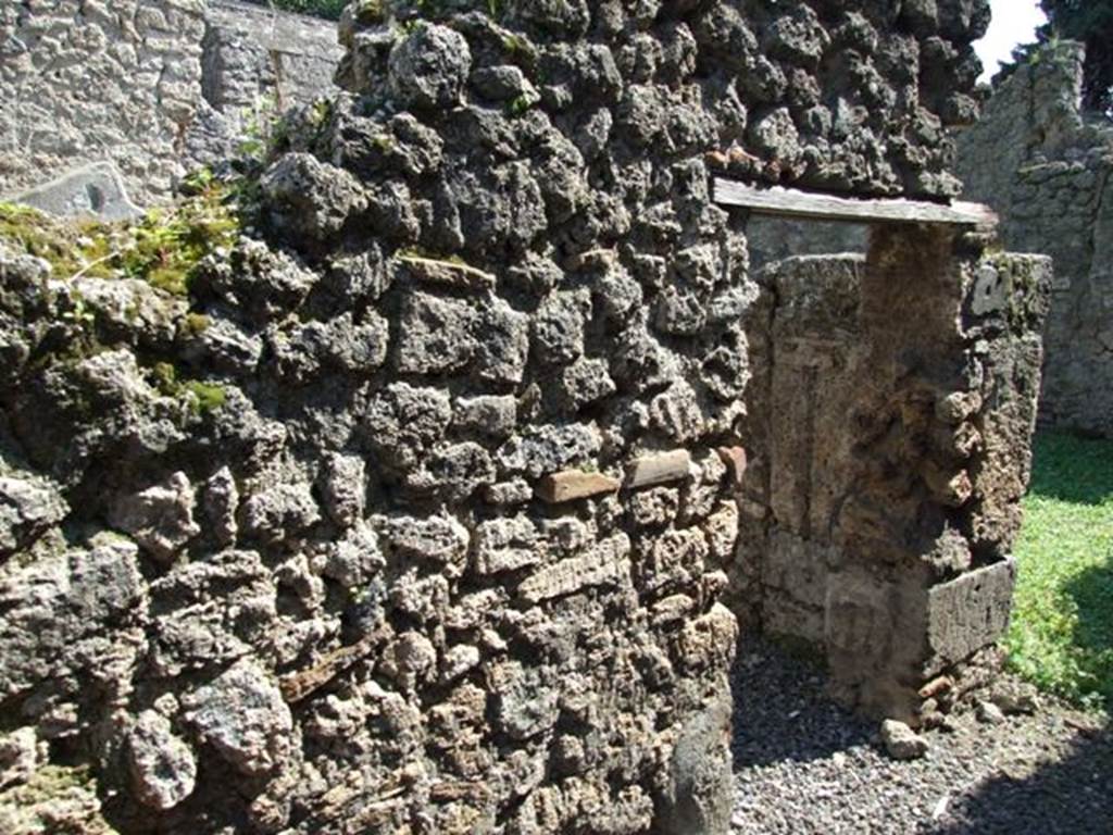 I.10.8 Pompeii.  March 2009.  Door to room 10 in East wall of kitchen.