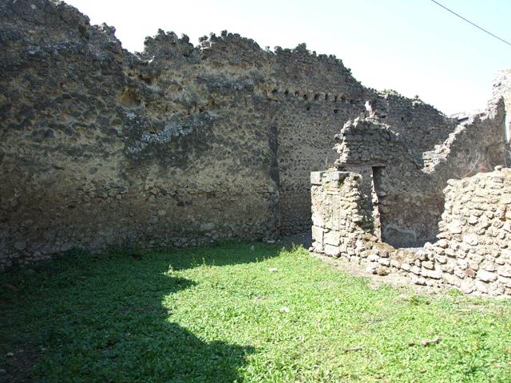 I.10.8 Pompeii. March 2009. Room 11, looking north-west across garden area to room 9 (left) and room 10 (right).