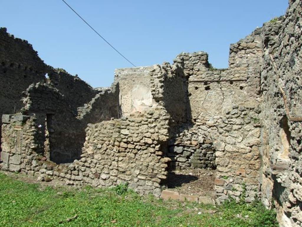 I.10.8 Pompeii. March 2009. Room 11, looking north across garden area to doorway to small room (exedra?), on right and room 10 on left.