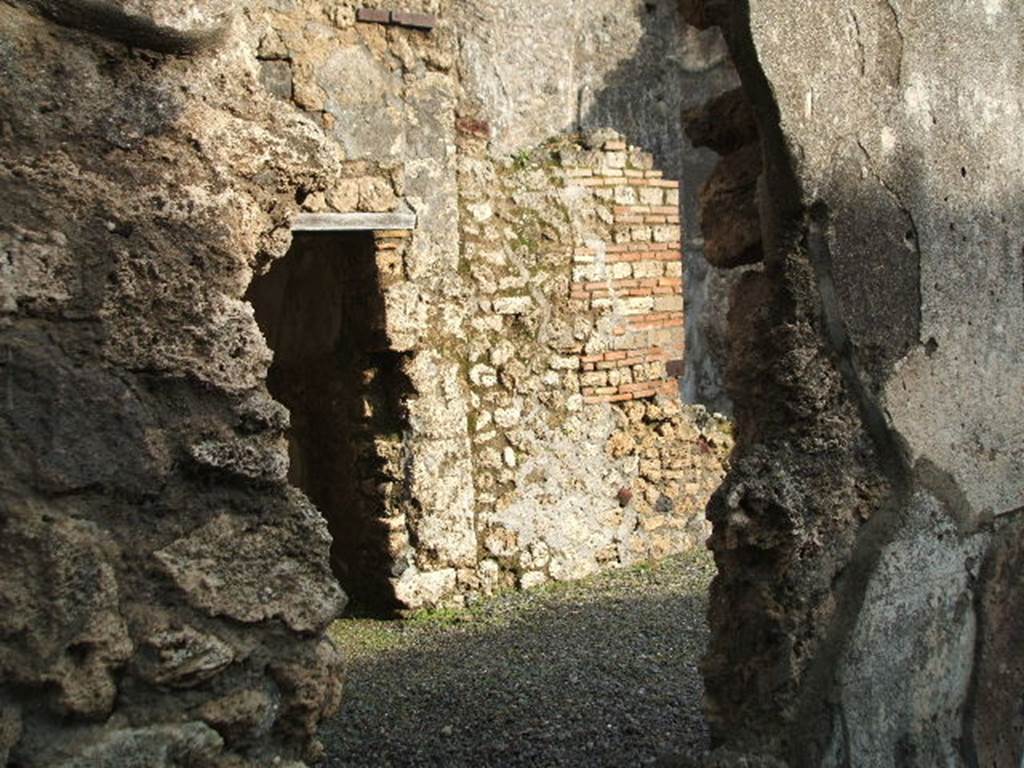 I.10.8 Pompeii.  December 2004.  Doorway to room 3 on east side of atrium.