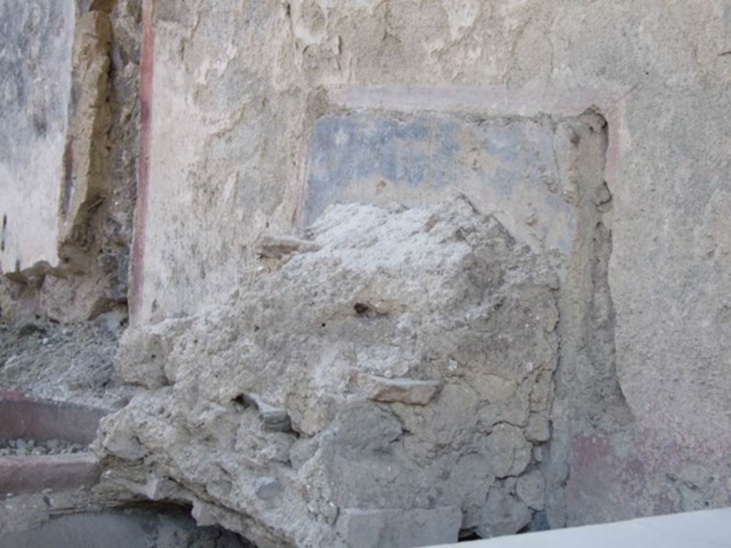 I.11.1 Pompeii.  Caupona.  West side.  Remains of shelves for displaying drinking vessels.