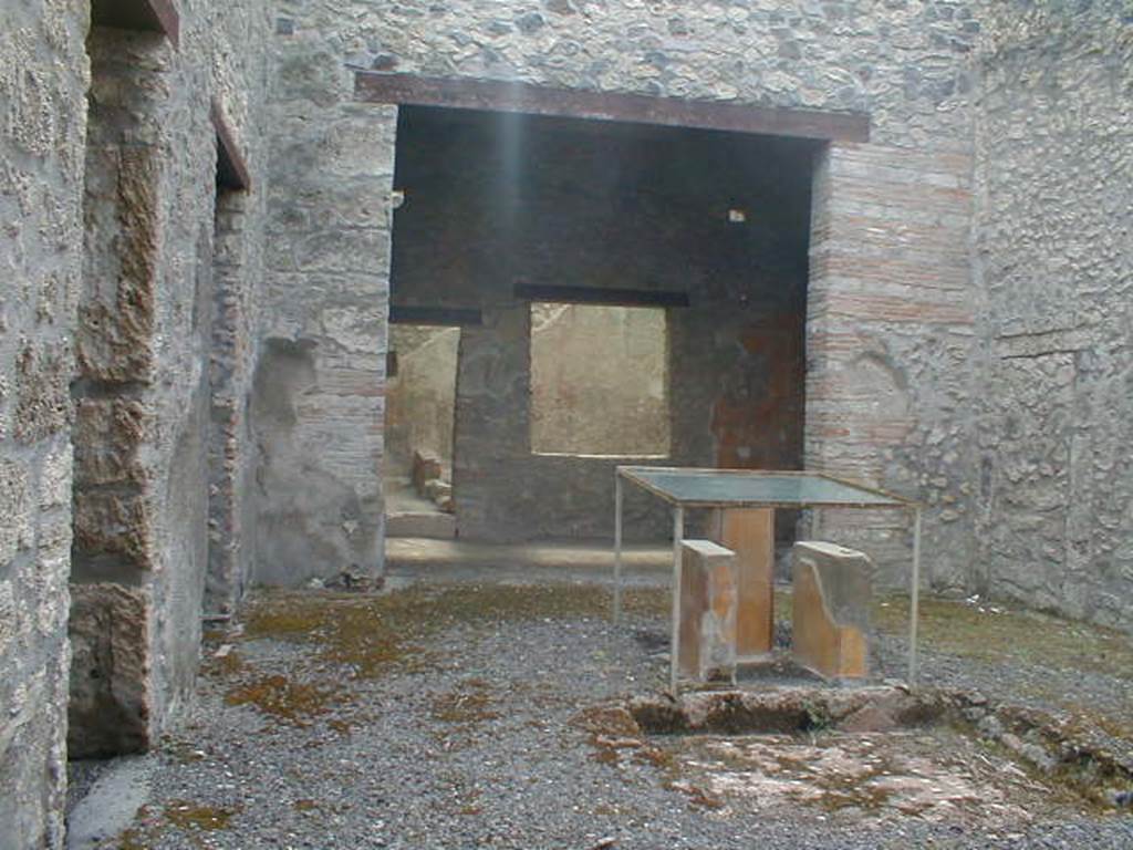 I.11.6 Pompeii. May 2015. Table supports and pedestal on which the statue of the Venus in the Bikini was probably found.
Photo courtesy of Buzz Ferebee.
