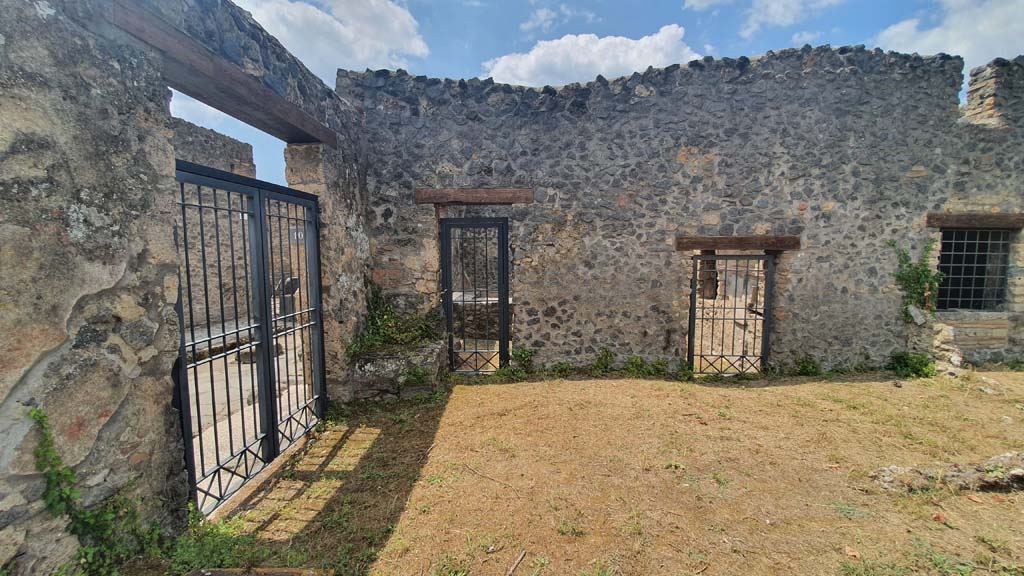 I.11.10 Pompeii. July 2021. 
Looking west towards entrance doorway, on left, two doorways into bar-room, and window into room for clients. 
Foto Annette Haug, ERC Grant 681269 DÉCOR. 
