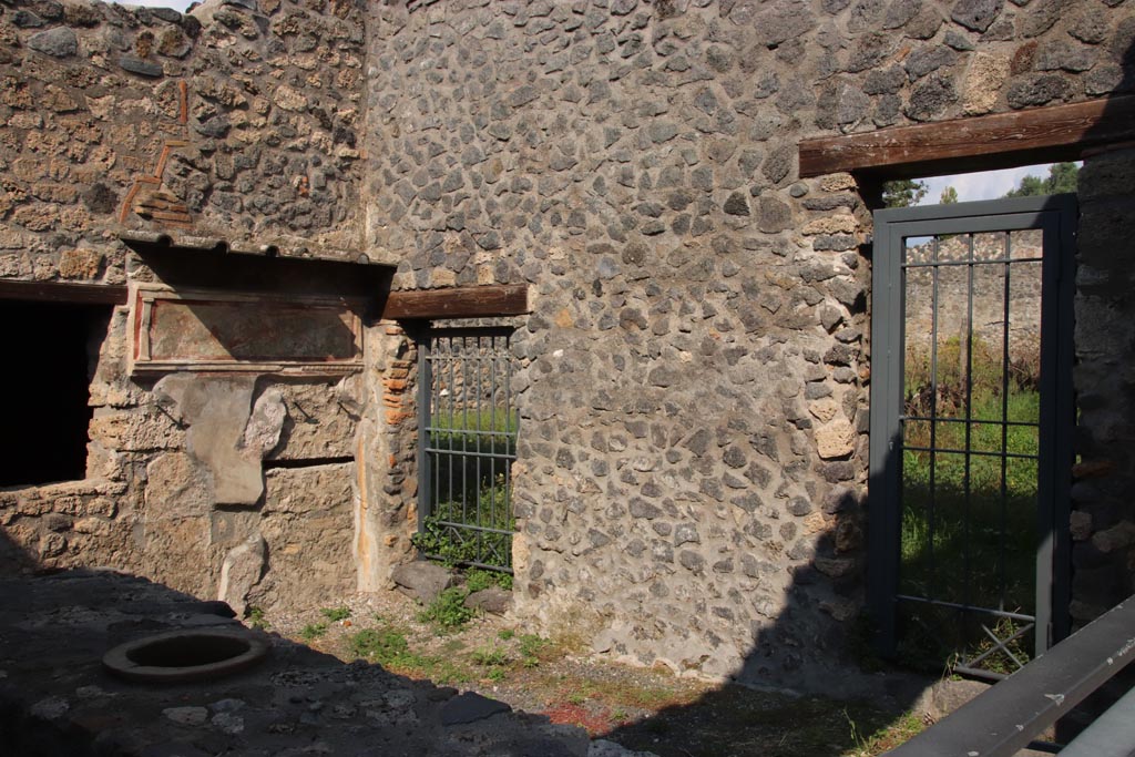 I.11.11 Pompeii. October 2022. Looking towards north-east corner and east wall of bar-room. Photo courtesy of Klaus Heese.