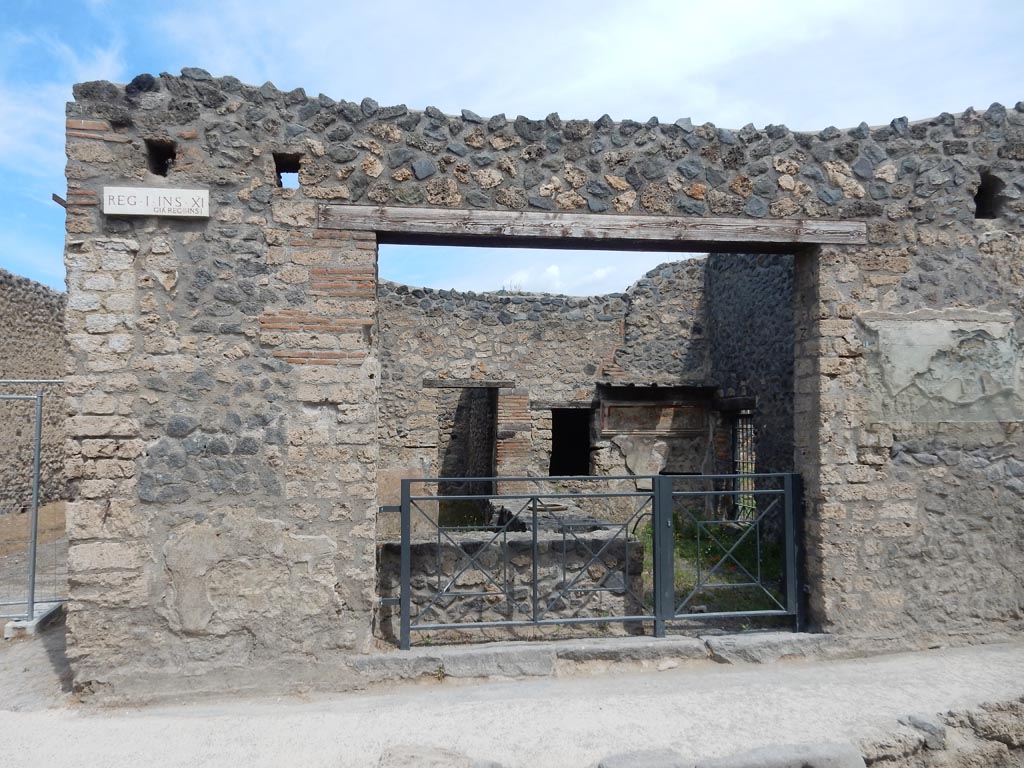 I.11.11 Pompeii. May 2017. Looking north to entrance doorway, with bar-counter. Photo courtesy of Buzz Ferebee.