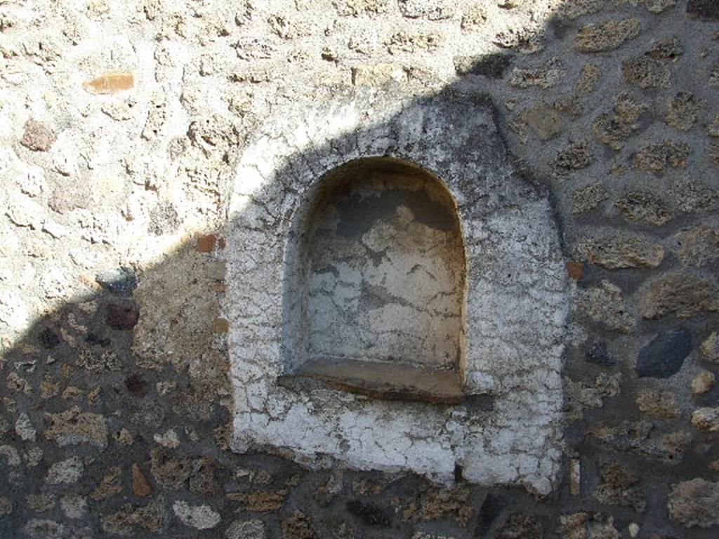 I.11.13 Pompeii. December 2006. Arched niche lararium on east wall.
The niche and surrounding wall panel were plastered and painted white.
See Giacobello, F., 2008. Larari Pompeiani: Iconografia e culto dei Lari in ambito domestico.  Milano: LED Edizioni. (p.258)

