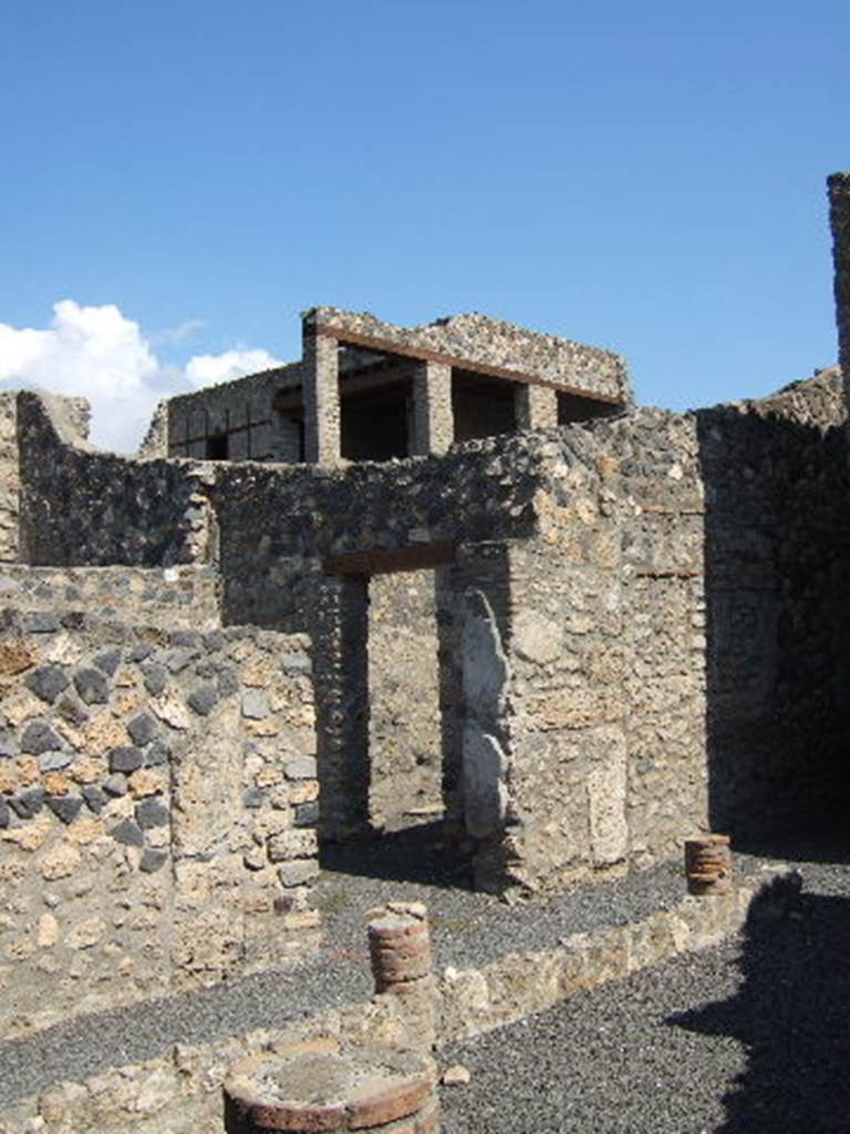 I.11.14 Pompeii. September 2005. Looking north-east across peristyle towards anticamera and doorway to triclinium.  