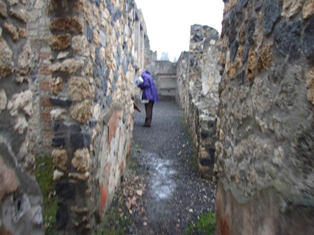 I.11.15 Pompeii. December 2007. 
Doorway to room 6, corridor or andron, looking east towards garden area, and rear doorway at I.11.9.
