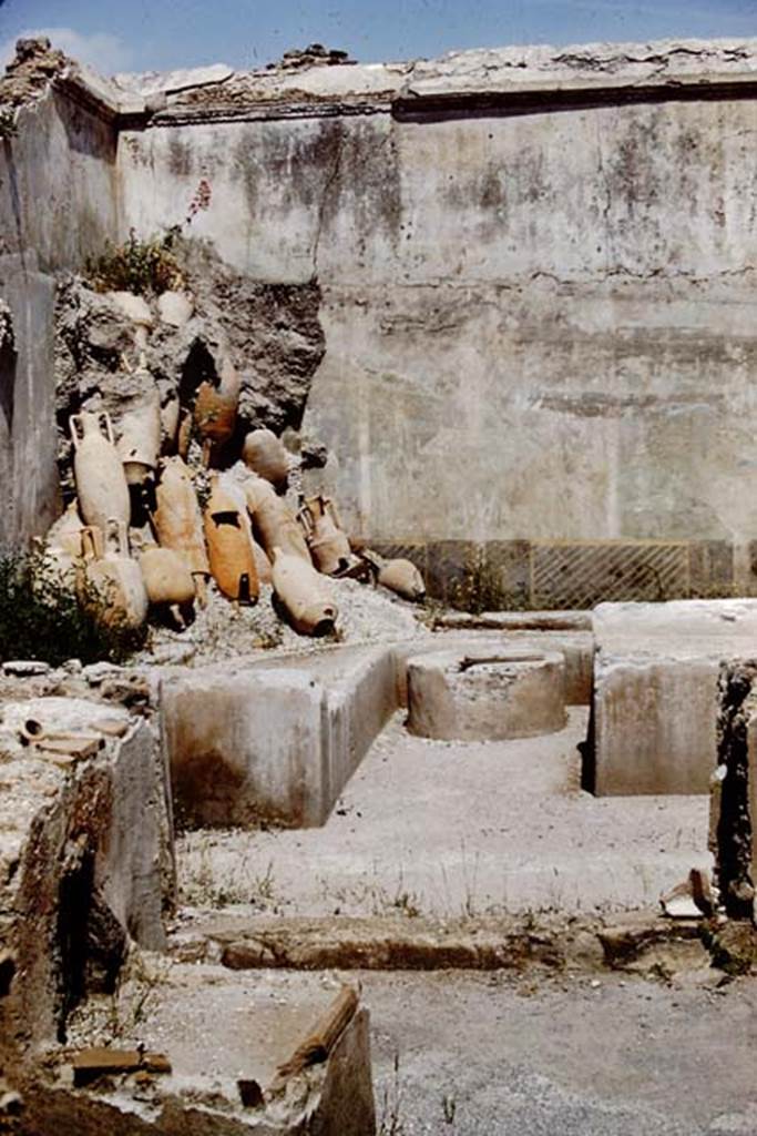 I.11.16 Pompeii. 1961. Looking towards north-east corner and heap of empty amphorae.   
Photo by Stanley A. Jashemski.
Source: The Wilhelmina and Stanley A. Jashemski archive in the University of Maryland Library, Special Collections (See collection page) and made available under the Creative Commons Attribution-Non Commercial License v.4. See Licence and use details.
J61f0240
